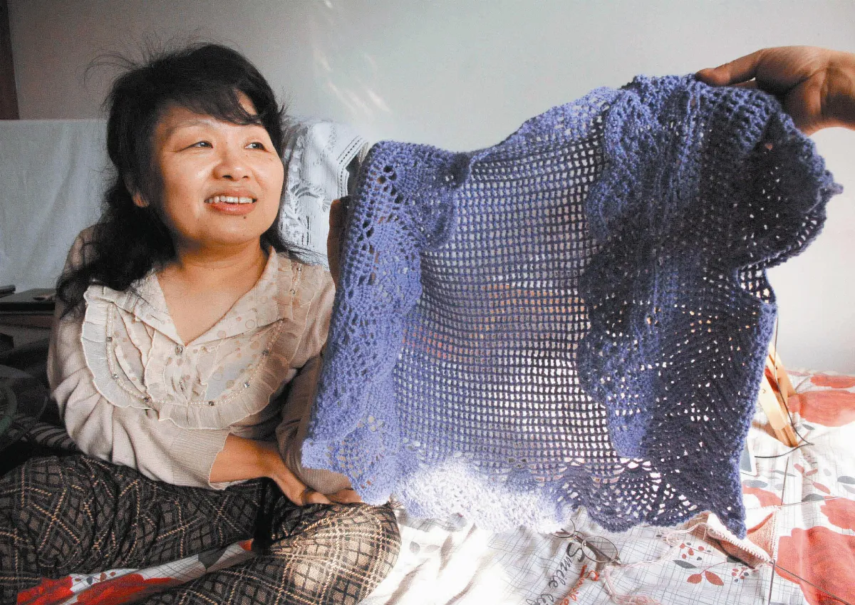 身殘志不餒 編織人生彩衣