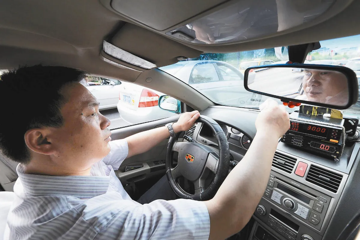 杭州的哥陳立虎自創共乘計費器