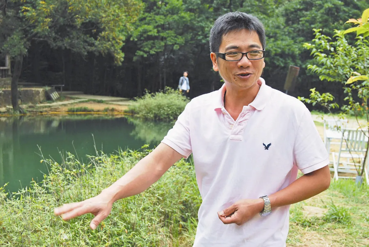 憨人  守護夢湖一肩扛廖元興甘做傻夢