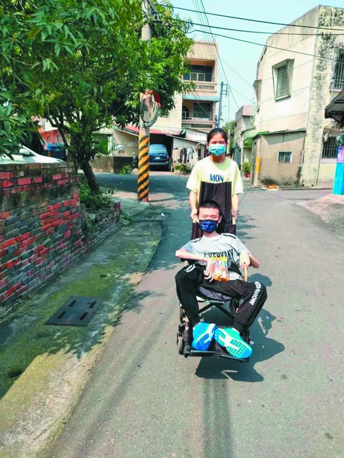 照顧2肌萎兄長 新住民勤學獲獎